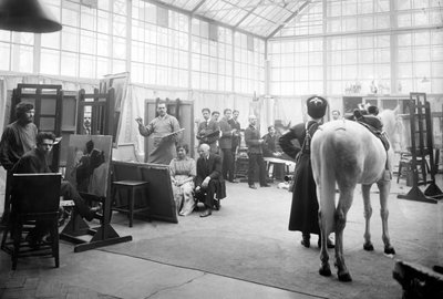 A Cossack and his horse pose for art students in the class of Professor Semionovich-Samokish, a specialist in military themes, Academy of Arts, St. Petersburg by Russian Photographer